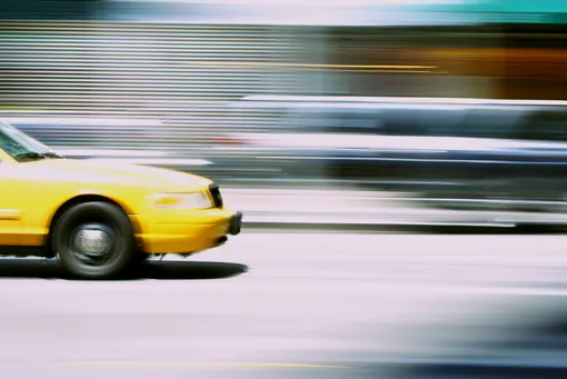 fast driving yellow taxi