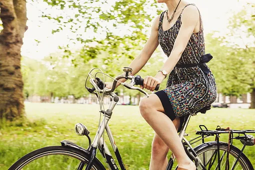 girl on a cruiser bicycle