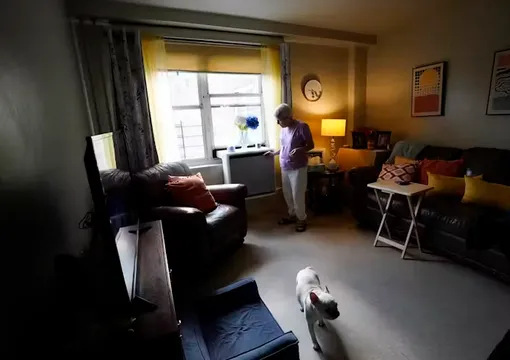 man and dog in apartment