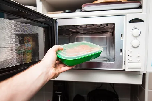 hand and microwave oven hand and microwave oven