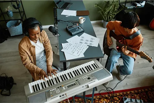 two musicians in a home studio