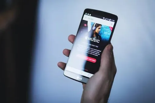 smartphone in hand apple music