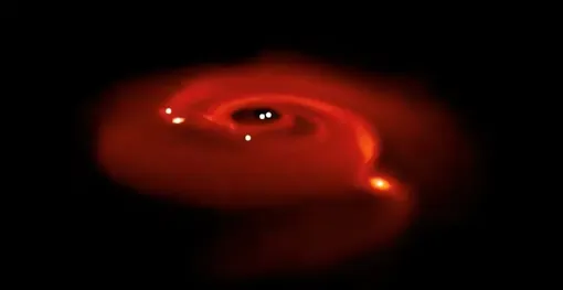 Компьютерная симуляция образования планет в диске вокруг двойной звезды.