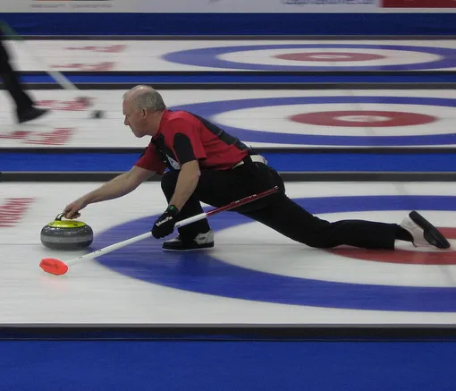 skip is throwing a stone curling