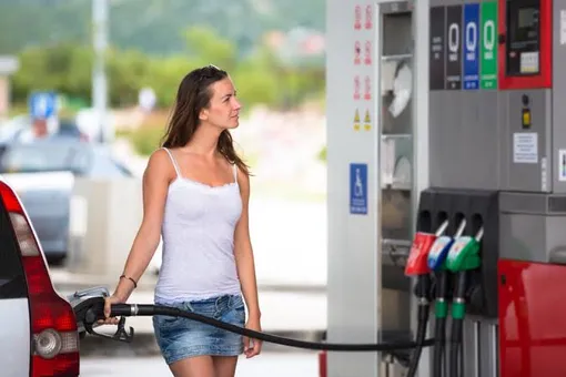 girl driver refuels her volvo